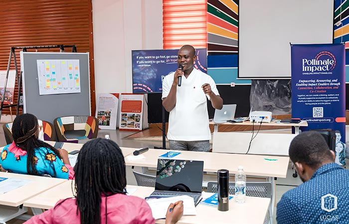 Design Team discussing the importance of gathering of metrics and the Pollinate Impact network strategy to do so.